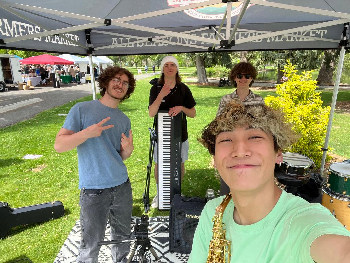 Photograph of Waking Hours
  at a farmers market